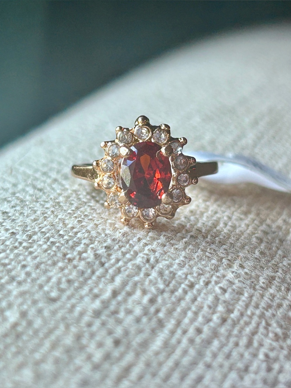 Gold Halo Ring with Deep Red Oval Stone - size 6